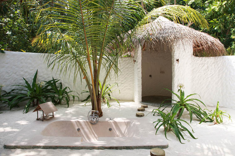 Wayfarers Atlas Soneva Fushi Maldives sunrise villa outdoor bathroom. The perfect family-friendly or group surf holiday destination