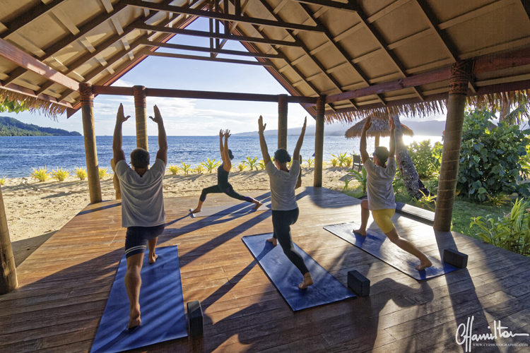 Guests doing Yoga at Qamea Island, Fiji
