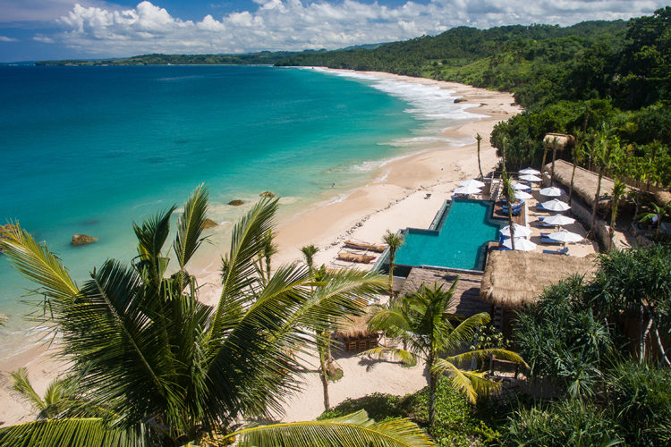 The beachfront Nio beach club and pool at Nihi Sumba the perfect destination for a family surf trip
