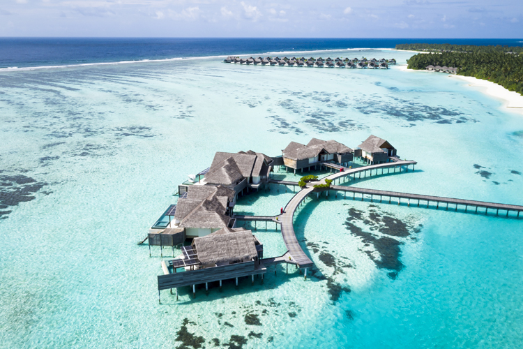 Niyama Private Island aerial view of overwater villas and surrounding turquoise waters