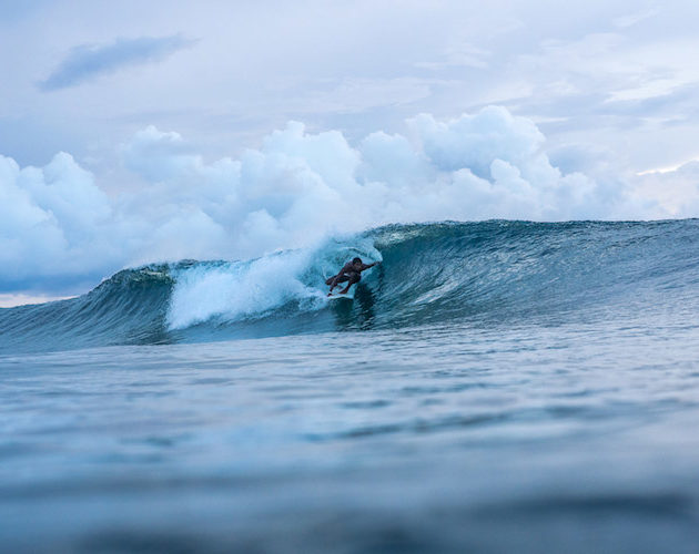 Surfing at Ayada Maldives a luxury resort perfect for your next family surf holiday