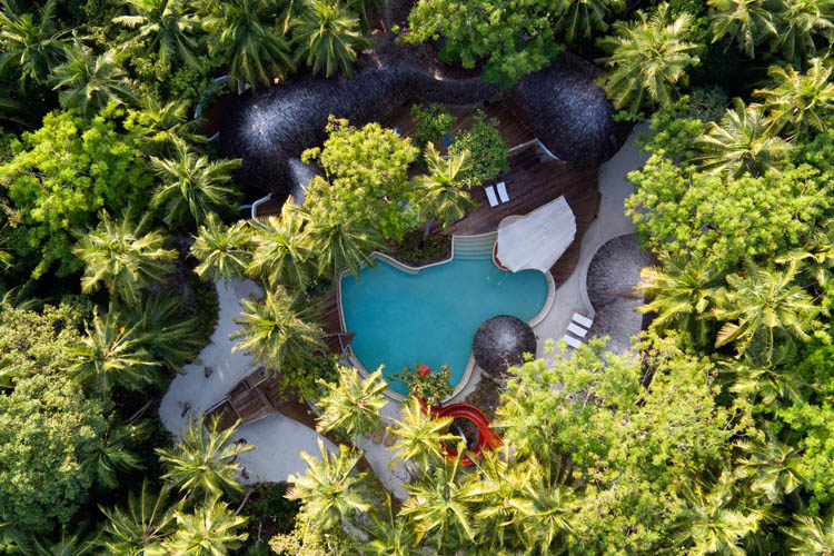Wayfarers Atlas Soneva Fushi Maldives aerial view of kids club. The perfect family-friendly surf holiday destination
