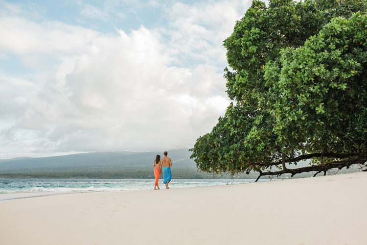 Couple walking along the beach at Sinalei Reef Resort & Spa, Samoa
