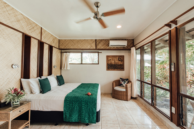 Interior of bedroom in Traditional Villa at Sinalei Reef Resort and Spa, Samoa
