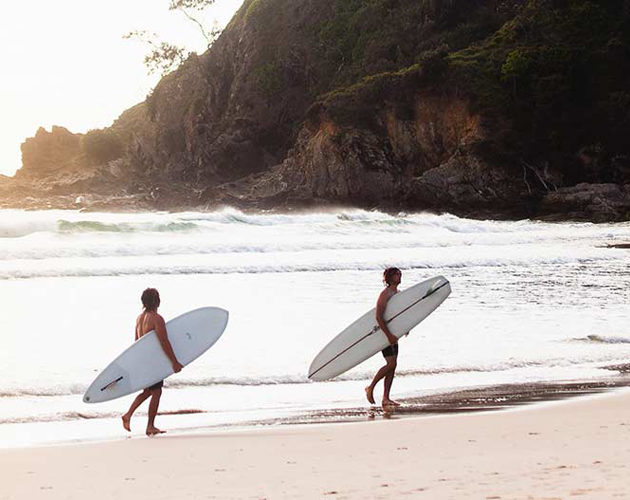 Surfers at Cabarita Beach infront of Halcyon House Australian Surf Resort