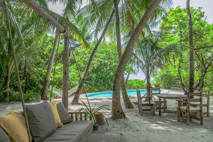 Wayfarers Atlas Soneva Fushi Maldives 4 bedroom soneva fushi villa with pool and outdoor sitting area. The perfect family-friendly surf holiday destination