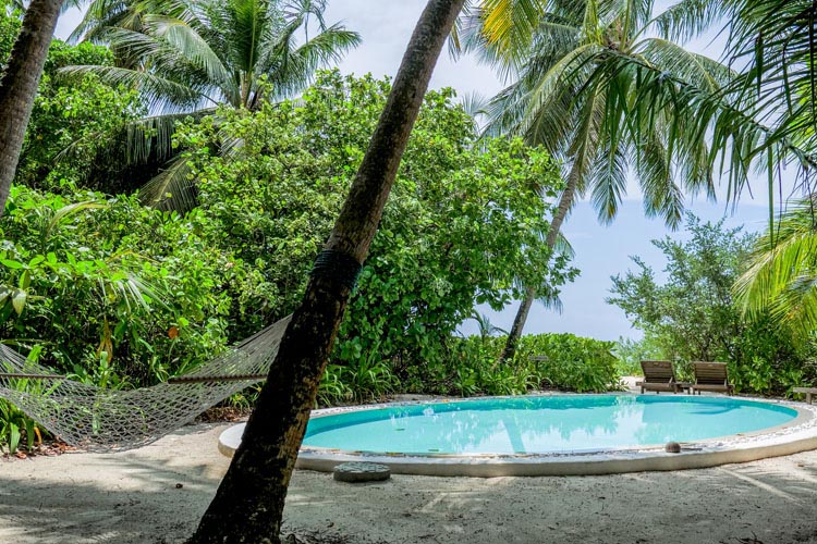 Wayfarers Atlas Soneva Fushi Maldives 4 bedroom soneva fushi villa with pool and hammock. The perfect family-friendly surf holiday destination