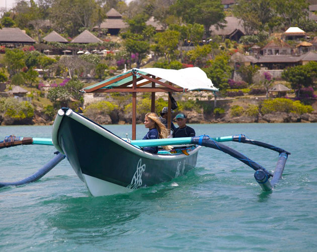 Surf boat transfer from Four Seasons Jimbaran Bay Bali, guided by Tropic Surf