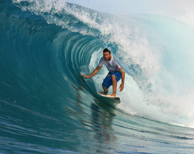 surfer getting barrelled Resort Latitude Zero