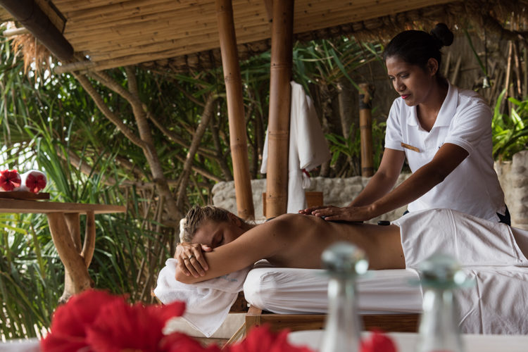 woman enjoying a massage at Nihi Sumba