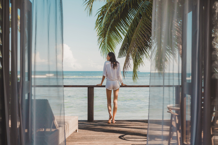 Lady overlooking the water at Sinalei Reef Resort & Spa, Samoa, the best couples surf destination
