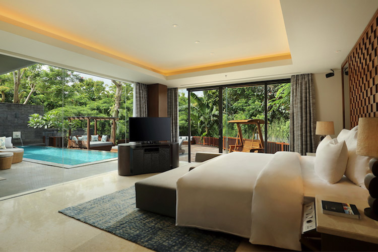 Interior of Garden View Pool Villa bedroom the perfect luxury space for a family surf trip