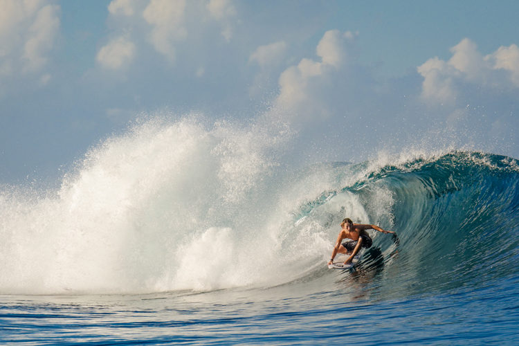 guy surfing Occy's left Nihi Sumba on family surf trip