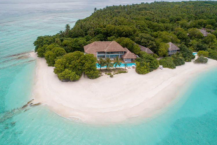 Wayfarers Atlas Soneva Fushi Maldives villa One aerial. The perfect family-friendly or group surf holiday destination