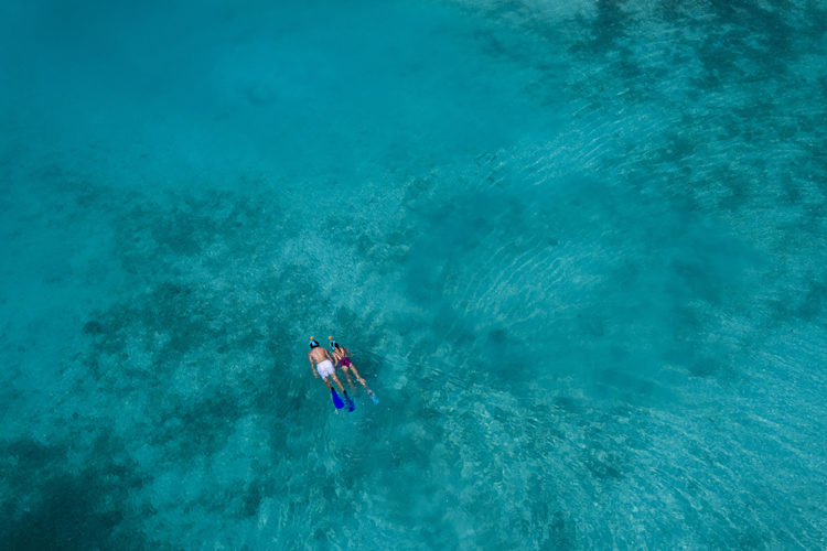 Anantara Veli aerial view of couple snorkelling