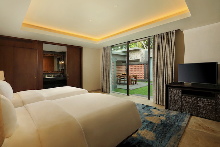 Interior of Garden View Pool Villa bedroom the perfect luxury space for a family surf trip