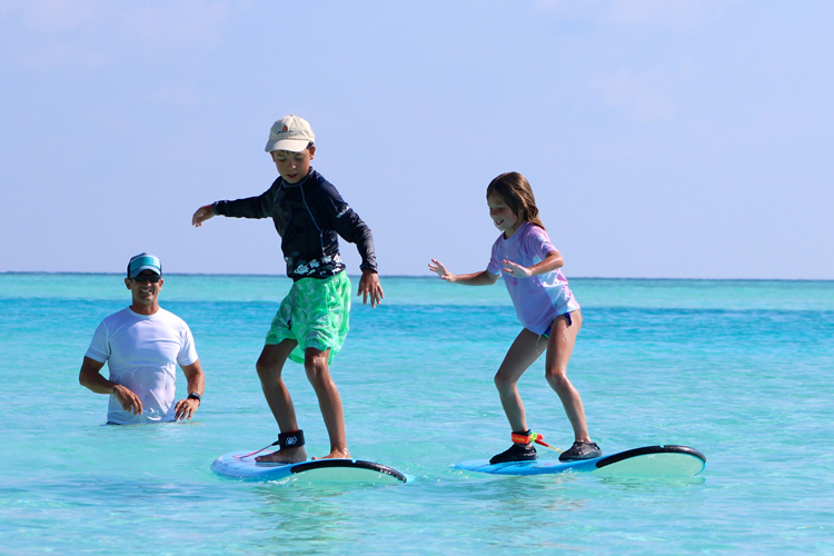 Anantara Dhigu Kids learning to surf with Tropic Surf the perfect family surf trip in the Maldives