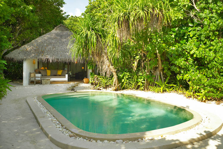 Wayfarers Atlas Soneva Fushi Maldives exterior of soneva fushi villa with pool. The perfect family-friendly surf holiday destination