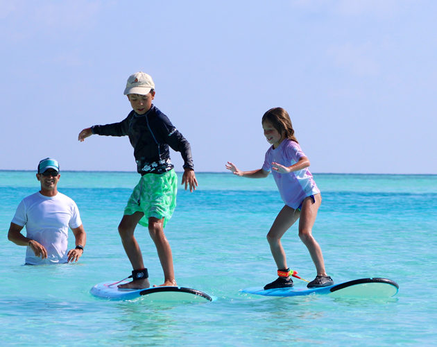 Anantara Dhigu Kids learning to surf with Tropic Surf the perfect family surf trip in the Maldives