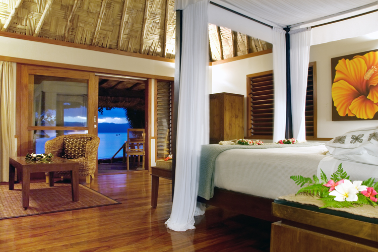 Interior of Honeymoon bure bedroom at Qamea Resort and Spa Fiji
