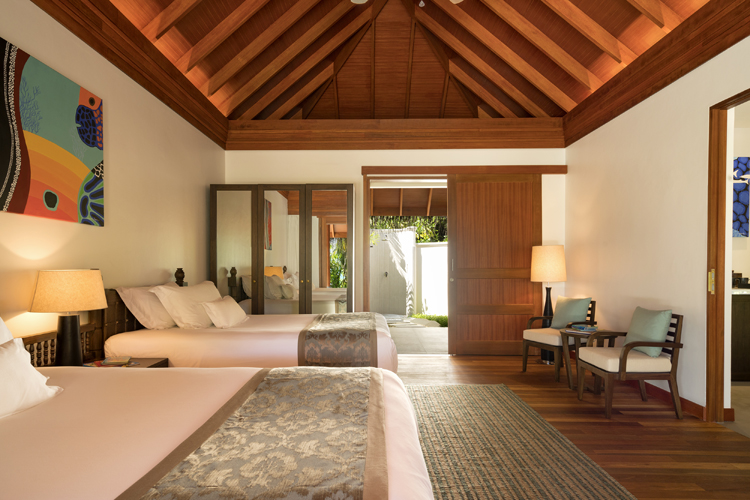 interior of bedroom in two bedroom family villa at Anantara Dhigu, Maldives