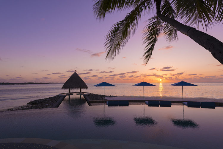 Four Seasons Kuda Haruu, Maldives sunset over Serenity Pool