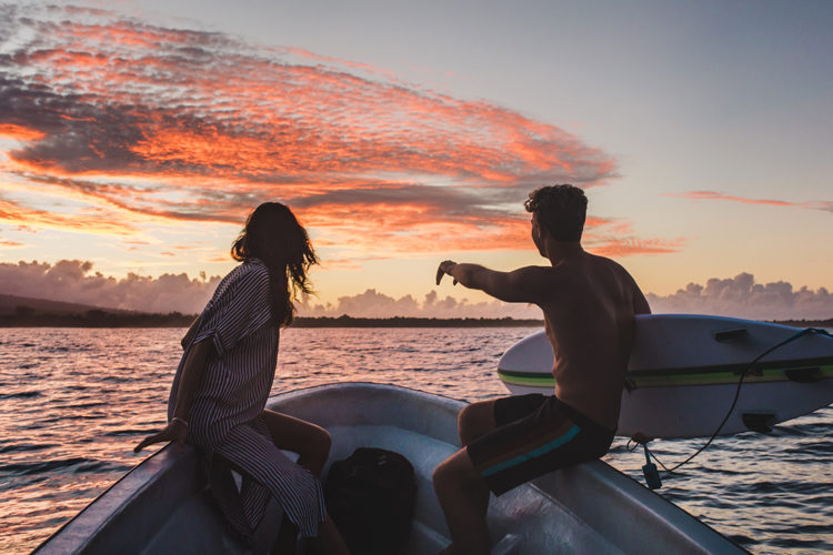 Couple on surf boat at Sinalei Reef Resort & Spa, Samoa