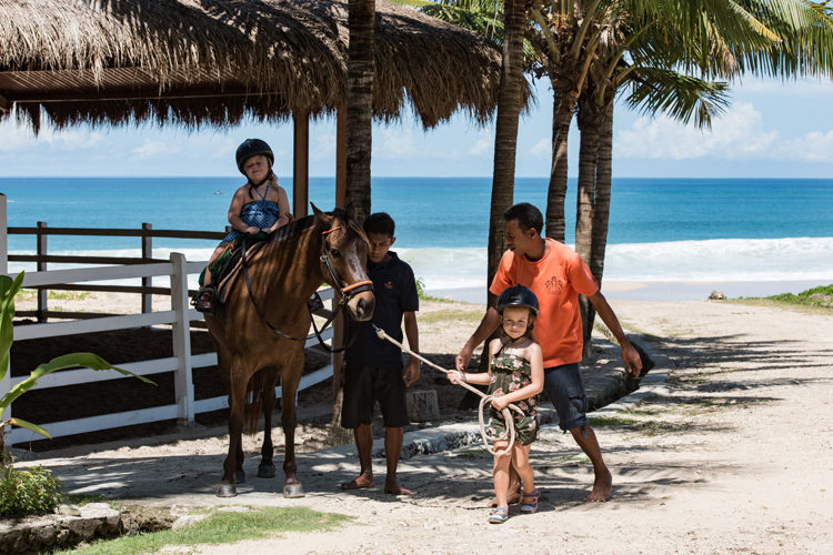 kids riding ponies at Nihi Sumba on family surf trip
